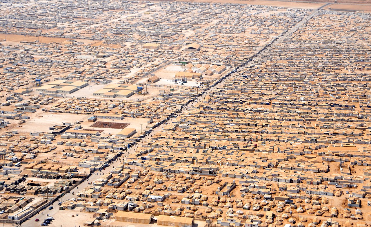 Aerial view of a large settlement in a arid land.