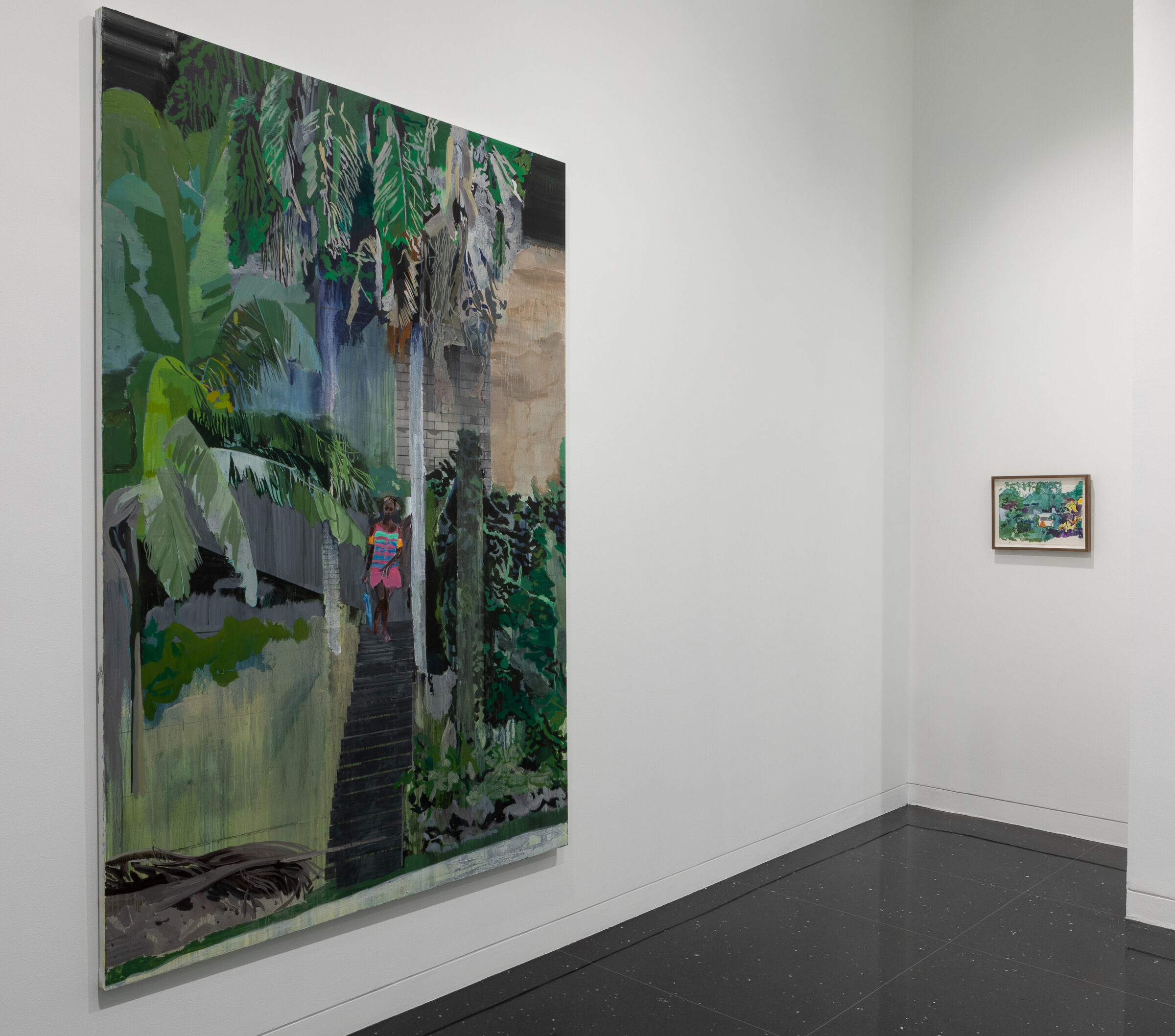 A small alcove in a white gallery in which hangs a small framed painting to the right and a large unframed painting of a young Black woman amidst a leafy, tropical landscape to the left.