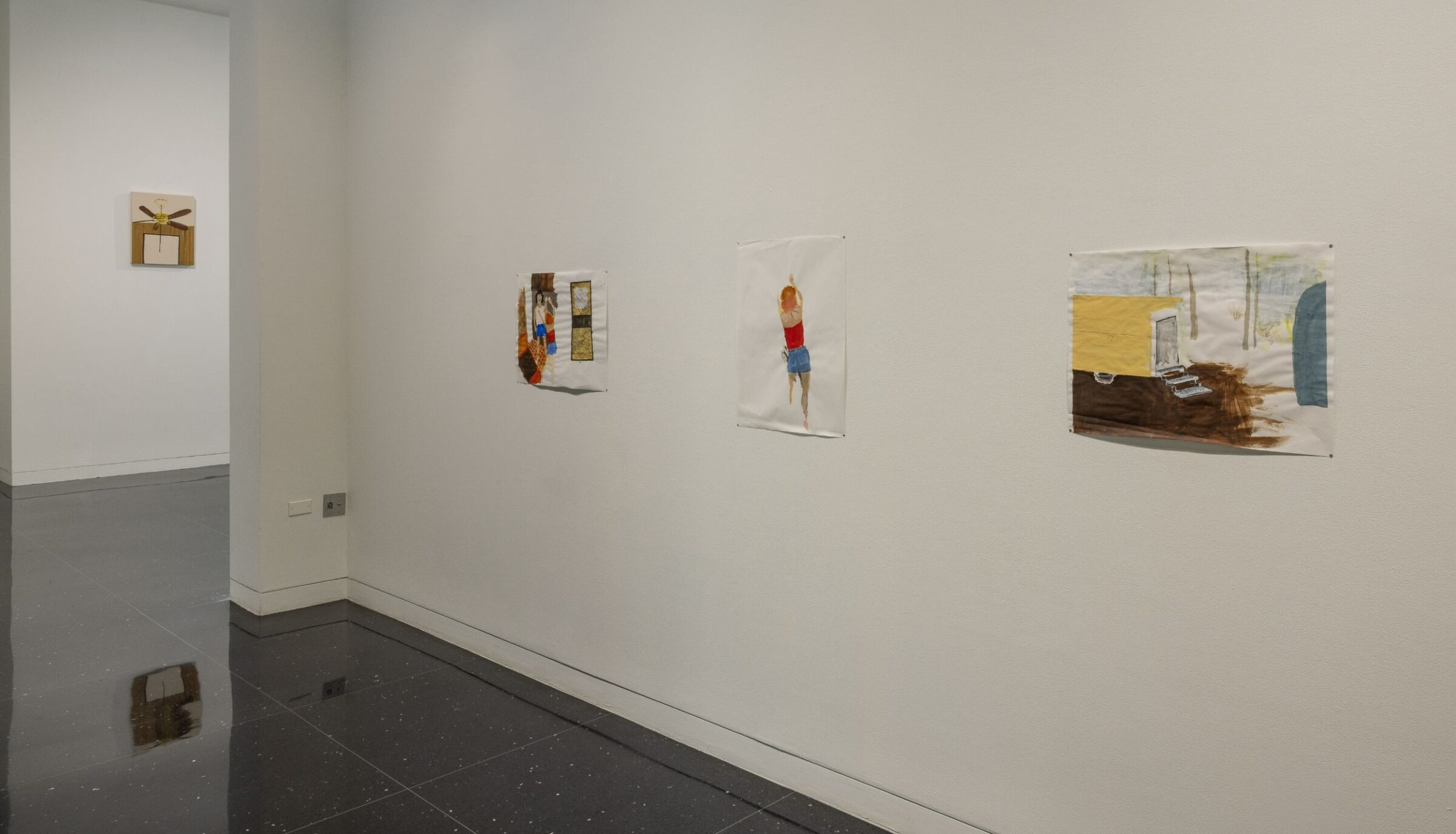 Three drawings arranged in a line on a white gallery wall. In the middle drawing is the figure of a woman in a red tube top and jean shorts.