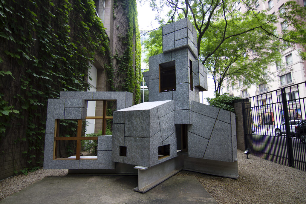 A one-story, discombobulated structure outside the ivy-covered brick exterior of The Arts Club of Chicago.