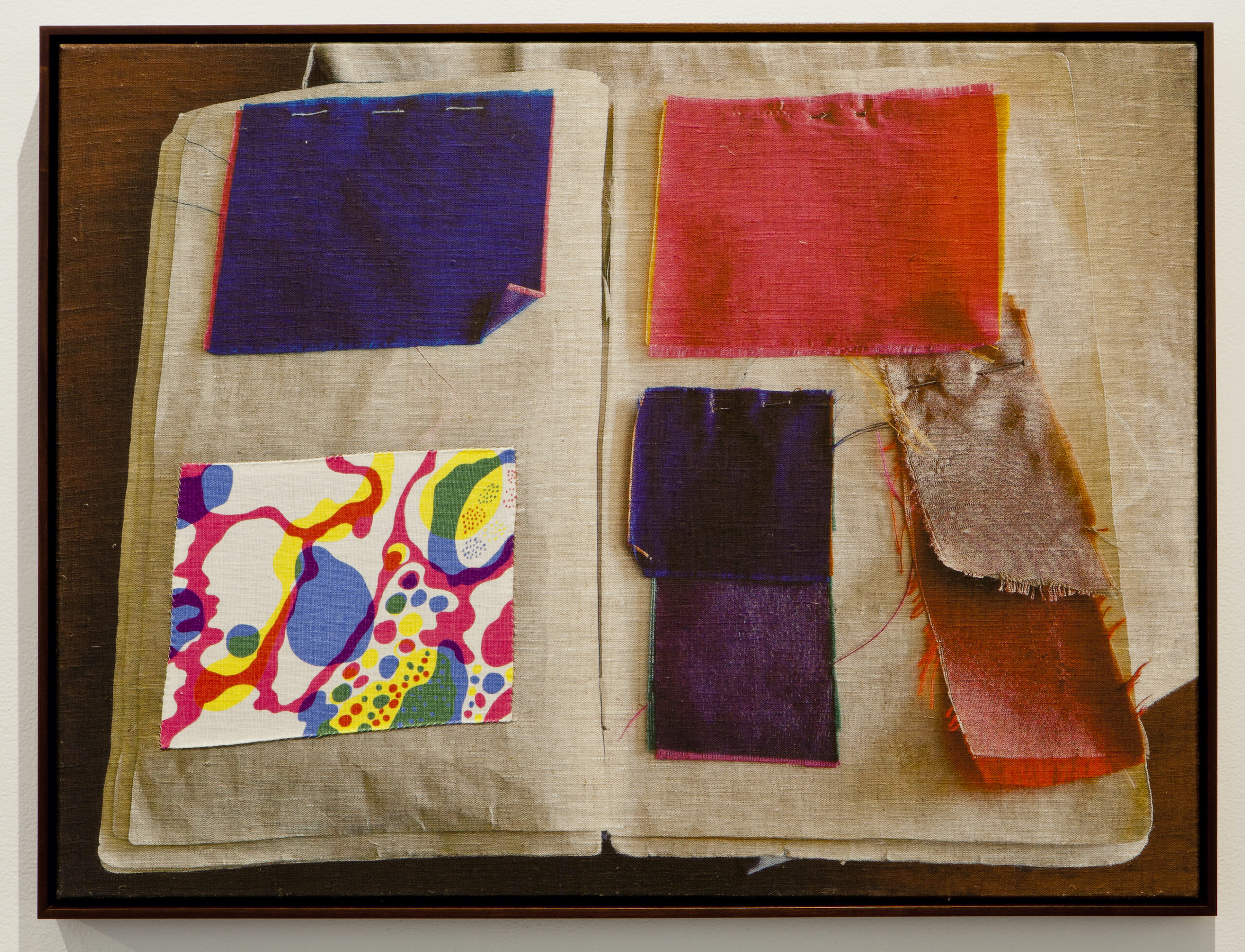 Various fabric swatches in an opened book.
